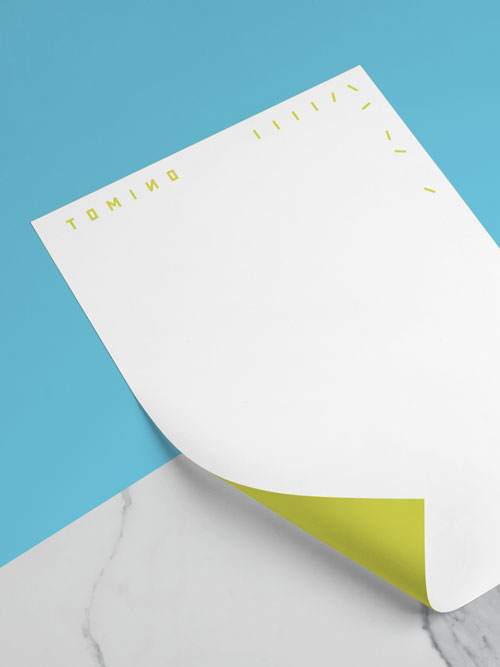 Tomino Beratung Corporate Design Briefbogen mit Logo und gelber Rückseite